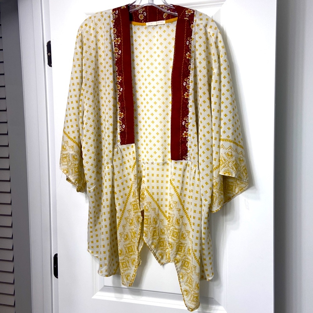 Boho top looks great with Burgundy tank top underneath